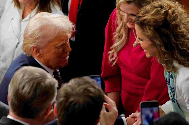 U.S. President Donald Trump meets with members of the U.S. Congress, after a joint session, in the House Chamber of the U.S. Capitol in Washington, D.C., U.S., March 4, 2025. REUTERS/Brian Snyder