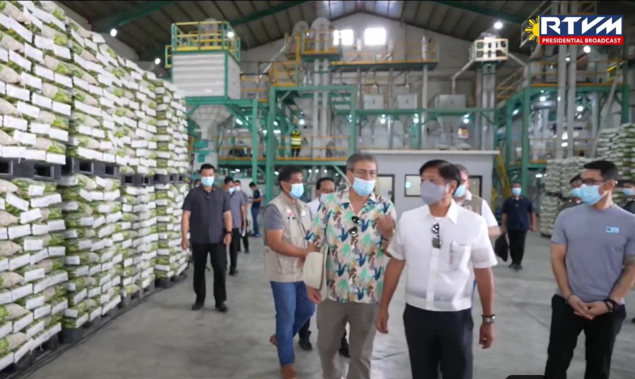 Marcos inspects Isabela's rice processing system