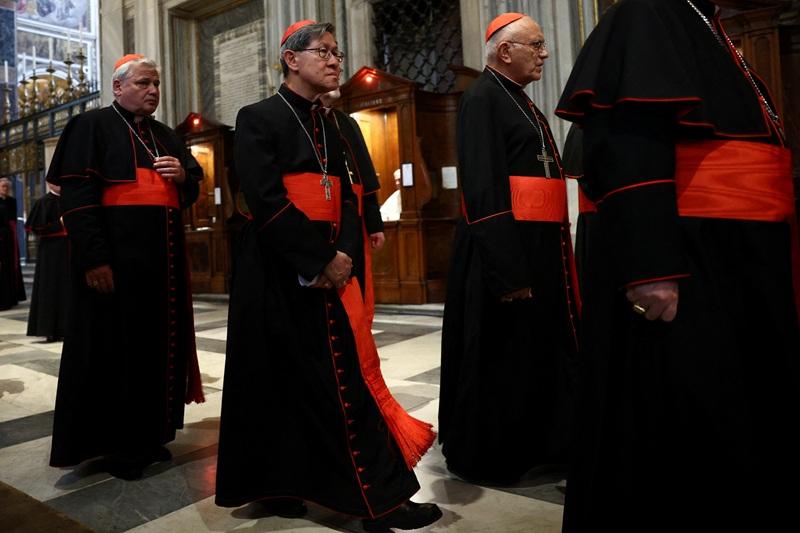 Cardinal Luis Antonio Tagle and Cardinal Konrad Krajewski leave along with other Cardinals after attending Vespers prayers at the Basilica of Saint Mary Major (Santa Maria Maggiore), in Rome, Italy, April 27, 2025. REUTERS/Guglielmo Mangiapane 