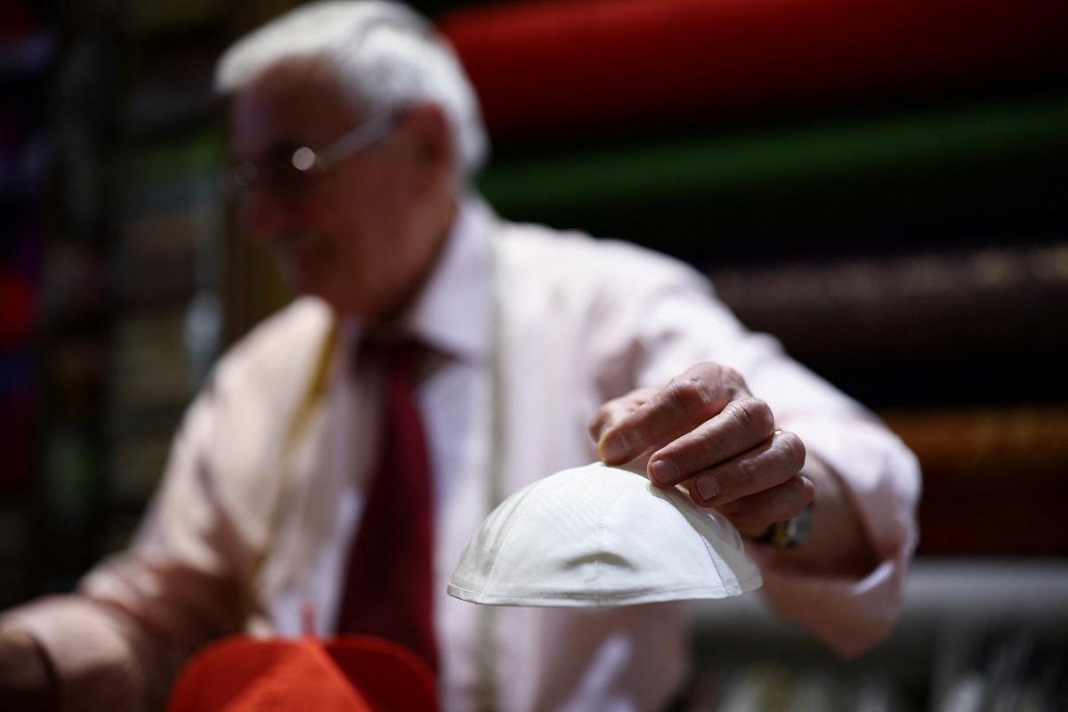 Small, medium or large? Papal tailor keeps his options open