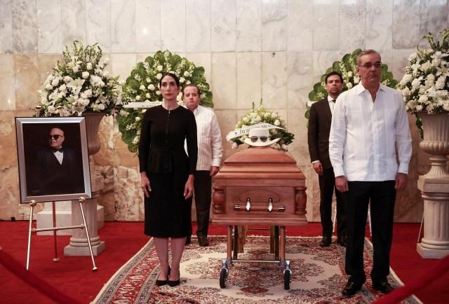 Dominican Republic's President Luis Abinader and first lady Raquel Arbaje stand next to the coffin of merengue artist Rubby Perez, who died when the roof of popular nightclub Jet Set collapsed during his concert, in Santo Domingo, Dominican Republic, April 10, 2025. REUTERS/ Erika Santelices