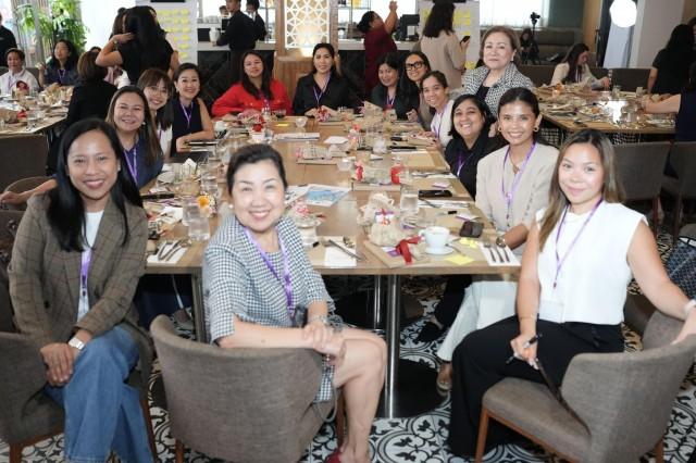 Breaking barriers together, attendees of &acirc;Our Seat at the Table&acirc; engage in meaningful discussions to shape policies and initiatives for women's empowerment.