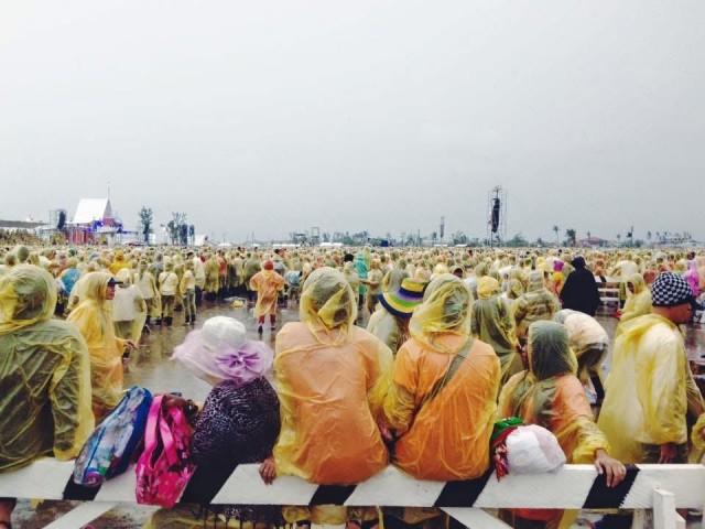 Clad in thin yellow plastic ponchos to protect them from the rain, the people of Tacloban waited for the Pope to appear. Photos: Amanda Tan Fernandez