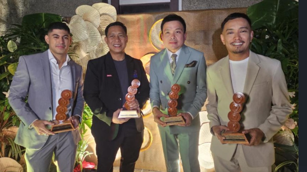 GMA personalities Martin Javier, Raffy Tima, Emil Sumangil and Joseph Morong proudly show their awards at the 19th Gandingan Awards. TEEJAY PUSONG