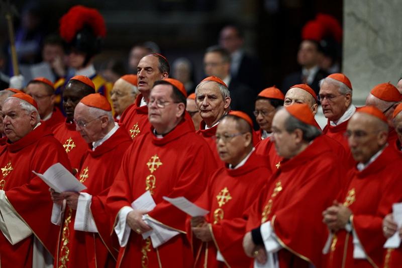 Manila Archbishop Cardinal Jose Advincula, Cardinal Matteo Zuppi attend along with other cardinals a mourning Mass for Pope Francis on the fifth day of Novendiali (nine days of mourning after the Pope's funeral) at St. Peter's Basilica at the Vatican, April 30, 2025. REUTERS/ Guglielmo Mangiapane 