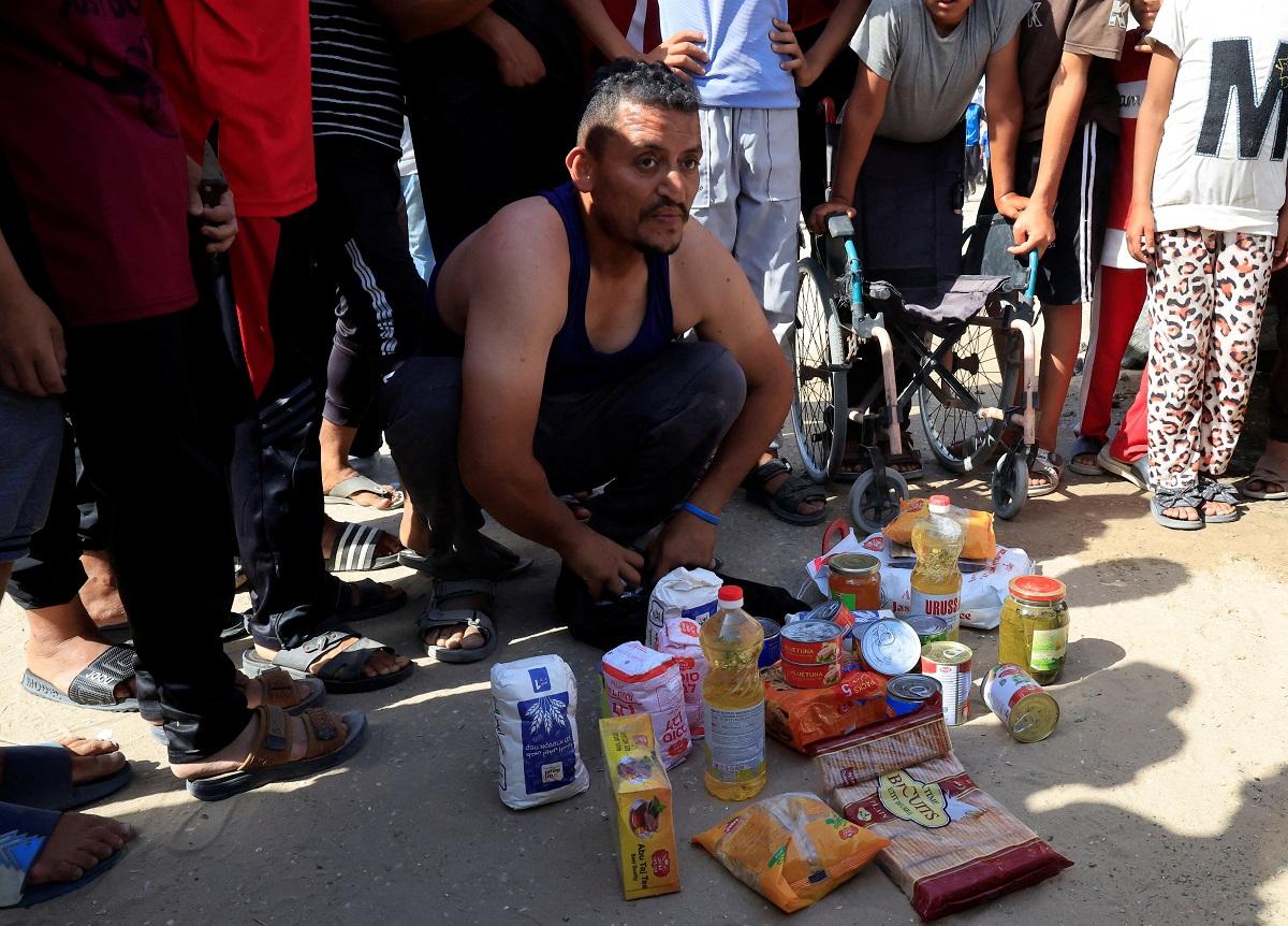 Palestinians rush to US-backed aid centers despite concerns over checks