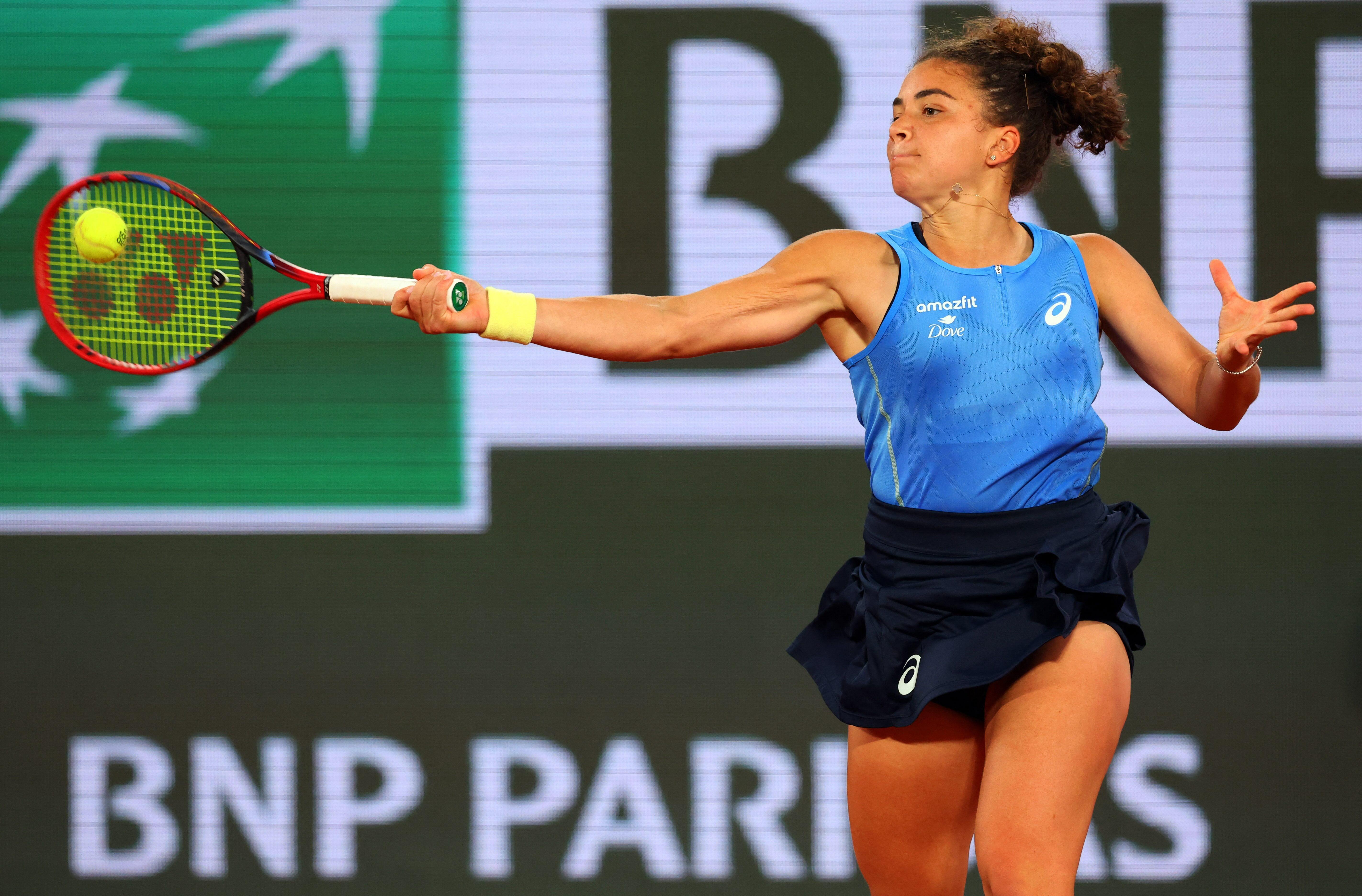 Big names crash but Italians shine on damp day at French Open