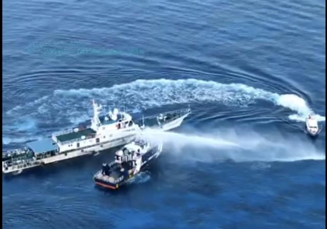 China Coast Guard vessel 21559 fires water cannon and sideswipes a BFAR vessel in Pag-asa Cay 2 (Sandy Cay) in the West Philippine Sea on Thursday, May 22, 2025. Screengrab from Philippine Coast Guard video