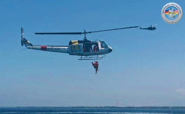 The Bell 205A conducting hoist operations to safely recover a simulated survivor during the Combat Search and Rescue operations in line with Exercise Balikatan 40-2025.
