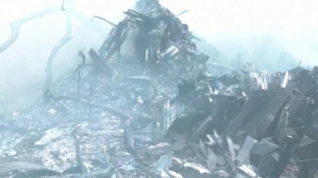 Smoke rises amidst debris after an Air India plane crashed in Ahmedabad, India, June 12, 2025, in this still image taken from video. ANI/ Reuters TV via REUTERS