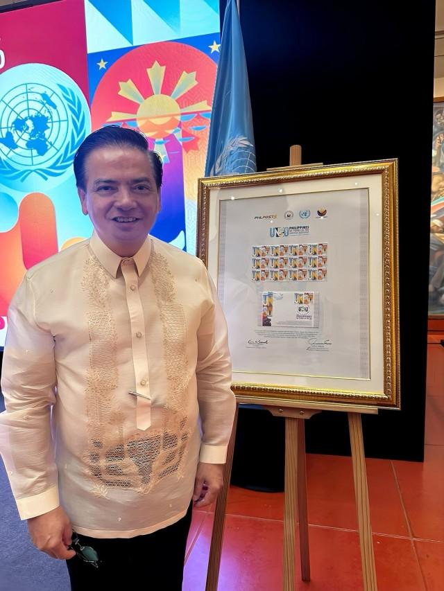 Foreign Affairs Undersecretary Charles Jose poses beside images of the UN80 Stamp during its launch, on June 25, 2025. JP Soriano/GMA Integrated News