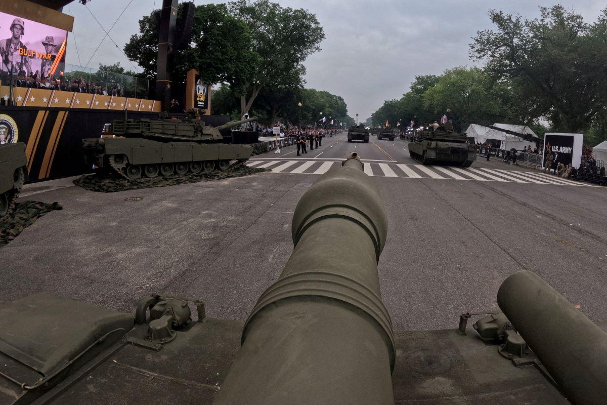 After day of nationwide protests, Trump's military parade rolls through DC
