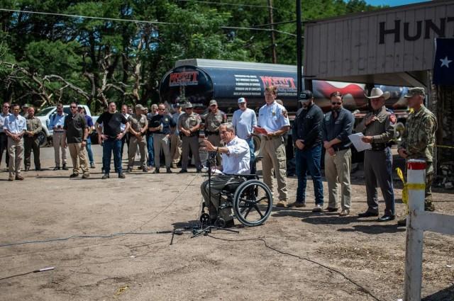Texas Governor Greg Abbott speaks to the media at a press conference in the aftermath of deadly flooding in Hunt, Texas, July 8, 2025. REUTERS/ Sergio Flores
