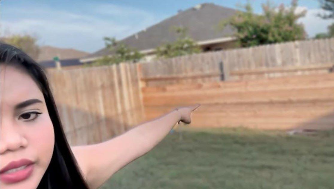 Pinay Bethany Bayer points to area that got flooded in Texas