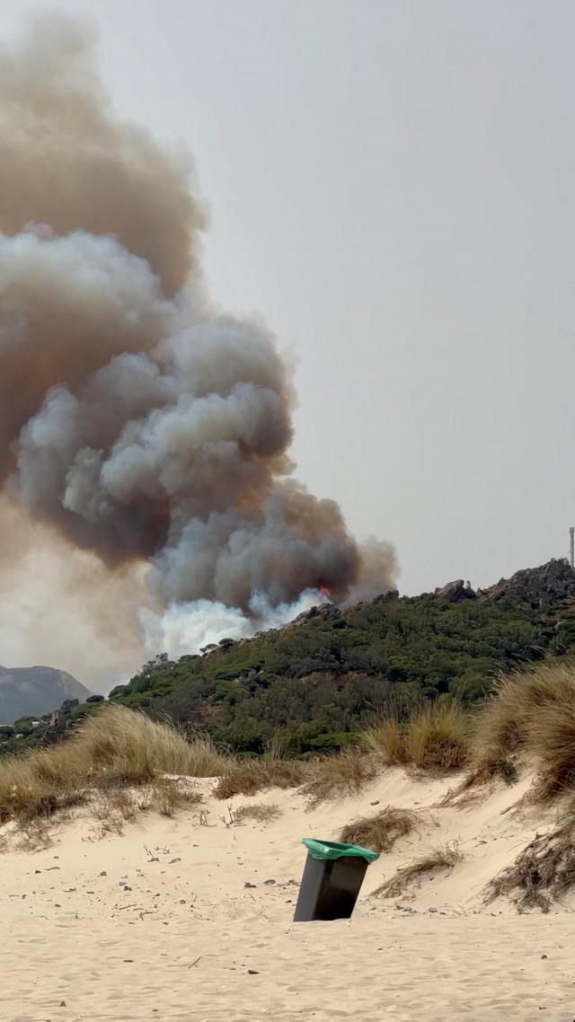 Smoke rises from a wildfire in Tarifa, Spain, August 5, 2025, in this screengrab obtained from a video. Ismael Bayarri Jaso/ via REUTERS