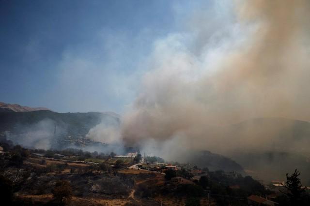 Smoke rises during a wildfire in Skioessa, near Patras, Greece, August 13, 2025. REUTERS/ Louiza Vradi
