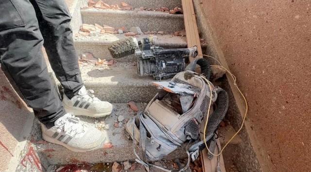 Equipment used by Palestinian cameraman Hussam al-Masri, who was a contractor for Reuters, lies at the site where he was killed, along with other journalists and people, in Israeli strikes on Nasser hospital, in Khan Younis in the southern Gaza Strip, in this still image taken from video, August 25, 2025. REUTERS/Hatem Khaled