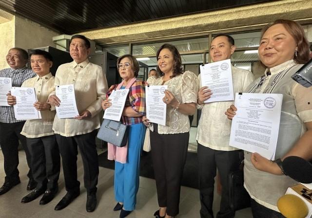 Lawmakers from the Liberal Party bloc in the House pose after filing the People&acirc;s Freedom of Information Act of 2025 at the House of Representatives on Monday, Aug. 4, 2025. The bill, which covers the executive, legislative, and judicial branches of government, as well as GOCCs, constitutional commissions, LGUs, SUCs, AFP, and other bodies, aims &acirc;to push for more transparency and accountability sa gobyerno natin,&acirc; said ML Party-list Rep. Leila de Lima. Tina Panganiban-Perez/GMA Integrated News