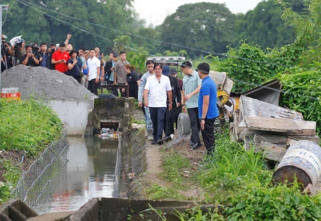 President Ferdinand 'Bongbong' Marcos Jr. checks on the reinforced concrete riverwall project in Barangay Piel, Baliwag, Bulacan on Wednesday, August 20, 2025. Marcos says he is 'very angry' that the P55-million project was recorded as completed but in reality was not. PPA