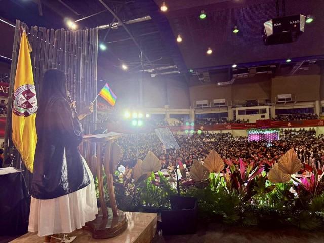 Prism speaks at their graduation.