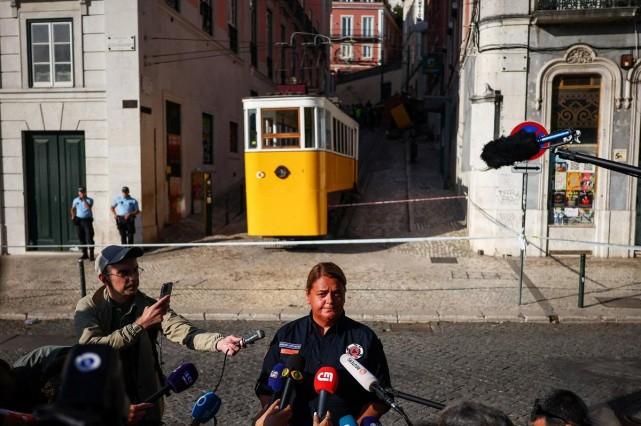 A civil protection officer speaks to the press near a Gloria funicular railway car that derailed and crashed, resulting in multiple casualties, in Lisbon, Portugal, September 4, 2025. REUTERS/ Pedro Nunes