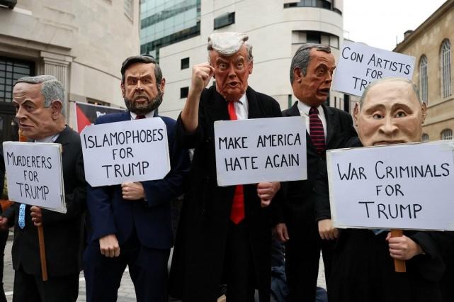 Demonstrators wearing masks take part in a 'Trump Not Welcome' protest during the state visit of US President Donald Trump and first lady Melania Trump, in London, Britain, September 17, 2025. REUTERS/ Hannah McKay