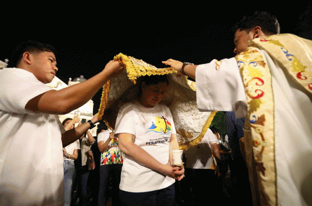 Duterte participated in the pagmamanto, where devotees pray over an individual covered by the mantle or cape worn by the miraculous image of Our Lady ofÂ PeÃ±afrancia, Sept. 14, 2025. (Photo by Jerwin Dumalasa)