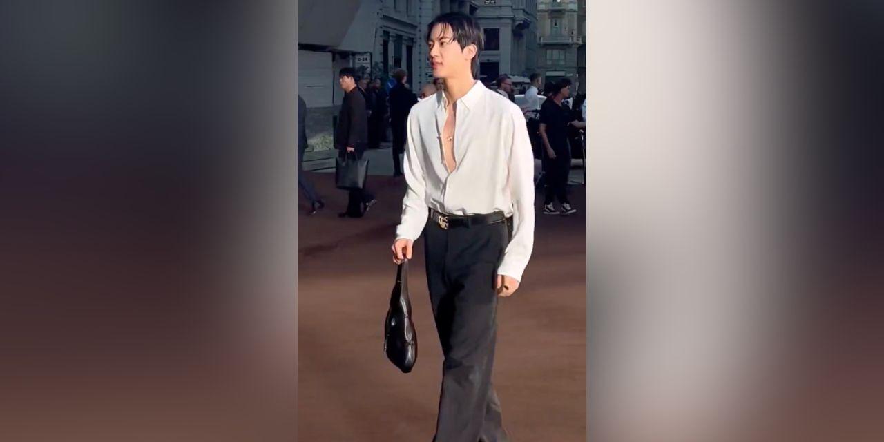Jin of BTS serves face at Gucci event in Milan