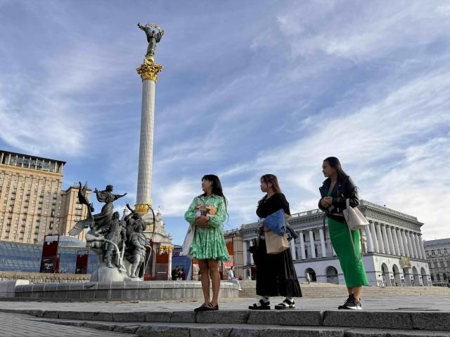 Despite the ongoing war in Ukraine, Eliza Dane Almonte, Navella Diane Botenco, and Rhea Rose Ramos (from left to right) are among the few Filipinos who have chosen to remain in Kyiv to live with their Ukrainian spouses. The three Filipinas visit the Maidan Independence Square in central Kyiv on Sundays to bond and check in on each other. Andy Peñafuerte III
