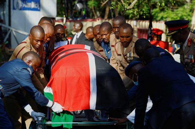 Military pallbearers position the flag-draped coffin of Kenya's former Prime Minister Raila Odinga, who died while receiving medical treatment in India, onto a catafalque during his burial at the Kango Ka Jaramogi home in Bondo, Siaya County, Kenya, October 19, 2025. REUTERS/ Thomas Mukoya