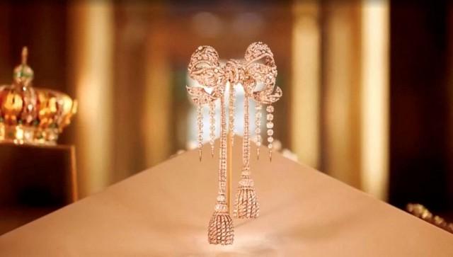 Among the items stolen by the thieves were jewelry worn by Empress Eugenie, the wife of Napoleon III, including (top to bottom) a jewel-encrusted brooch, a tiara adorned with pearls, and a crown. The thieves apparently dropped the crown during their escape and it was recovered damaged. Louvre Museum/ Handouts via REUTERS