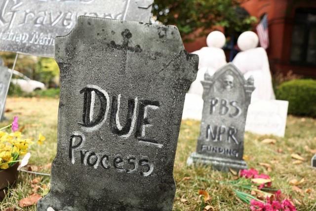 Politically themed Halloween gravestone decorations in the Project 2025 Graveyard are seen at the home of Donna Breslin in Washington, D.C., October 29, 2025. REUTERS/ Kevin Lamarque 