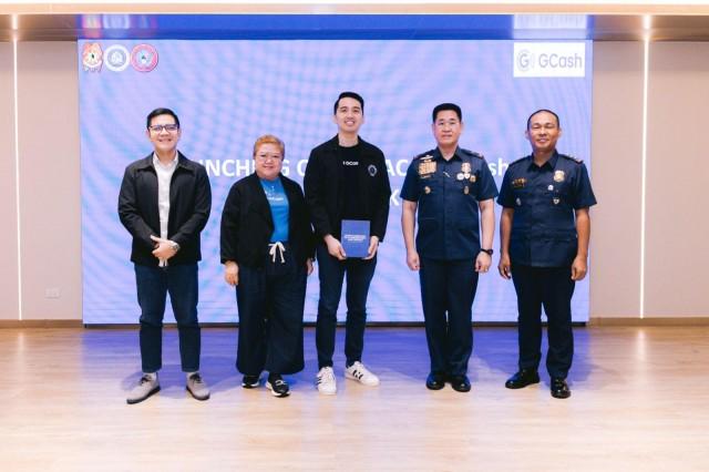 Miguel Geronilla, GCash Chief Information and Security Officer and PNP-ACG Director, PBGen Bernard Yang leading the official turnover of the Cybersecurity and Fintech Handbook