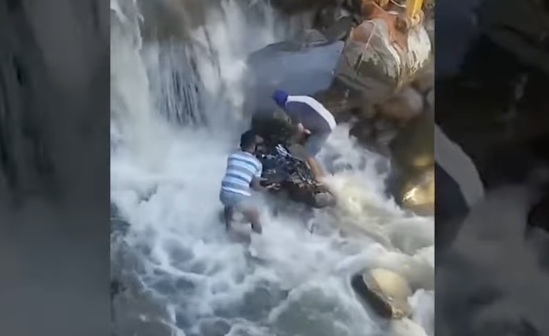 Motorcycle swept away after rider tried to cross raging waters in Davao City