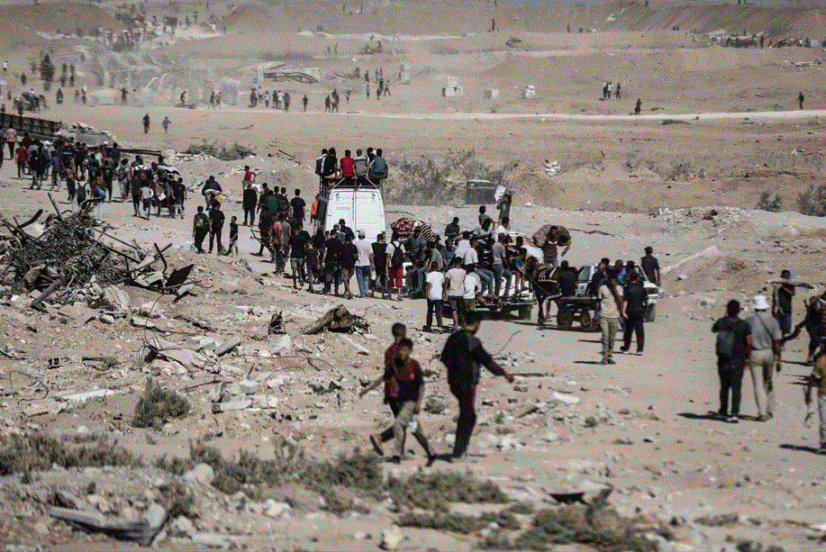 Gazans stream towards wrecked homes as Israeli forces pull back under ceasefire