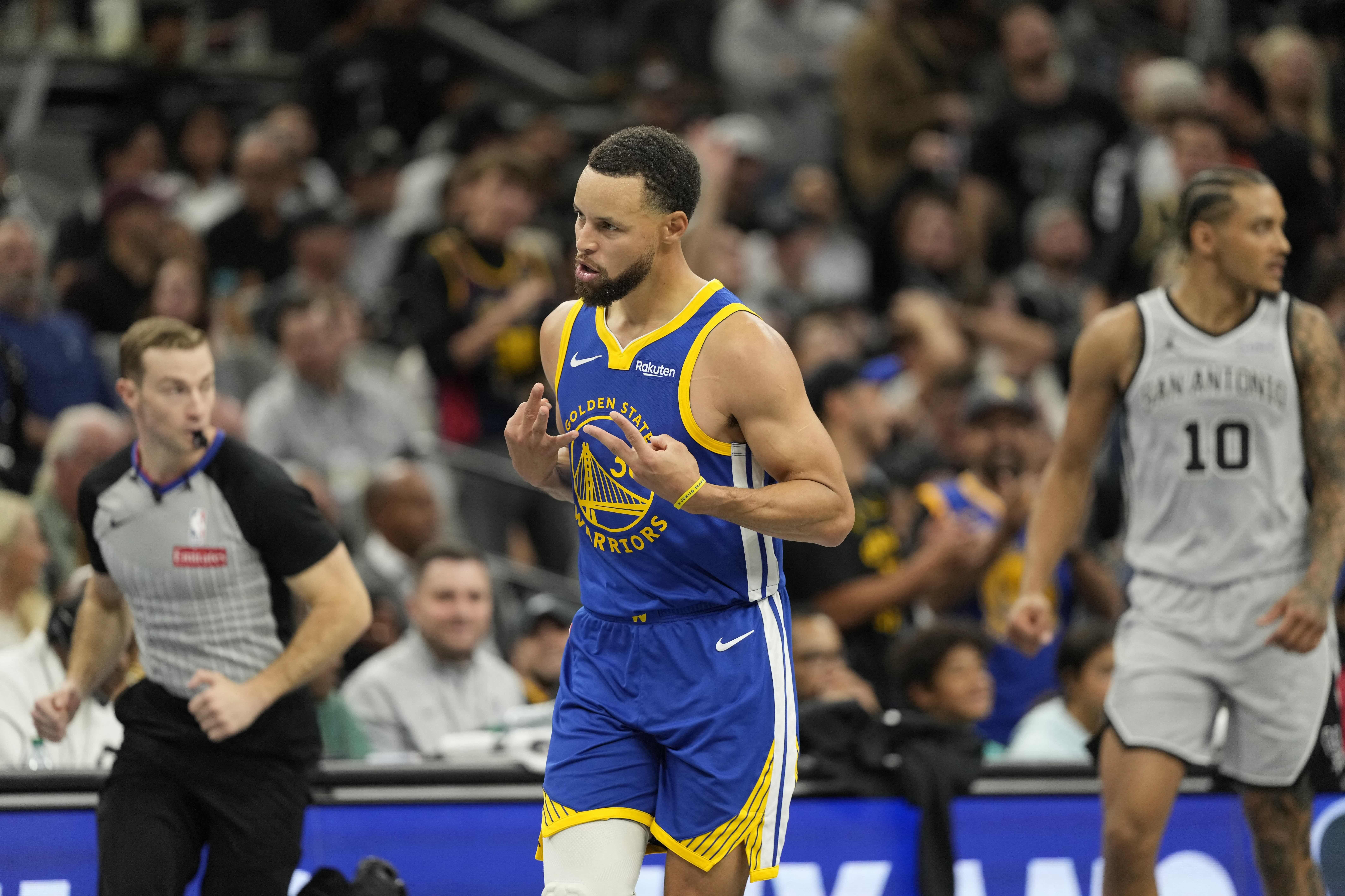 NBA: Stephen Curry reels off 49 points as Warriors rally past Spurs