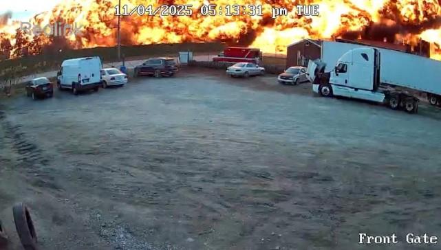 Smoke and flames rise as a UPS cargo plane crashes in Louisville, Kentucky, November 4, 2025, in this screengrab obtained from social media video. Kentucky Truck Parts & Service/ via REUTERS