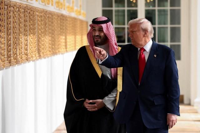 US President Donald Trump and Saudi Crown Prince and Prime Minister Mohammed bin Salman look at portraits at the Presidential Walk of Fame in the Colonnade at the White House in Washington, D.C., November 18, 2025. REUTERS/ Evelyn Hockstein 