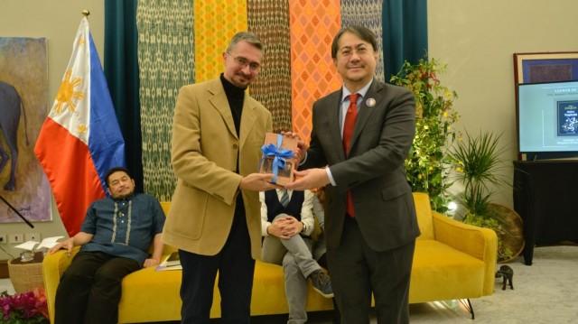 Guido del Duca (left) of Italian publishing house Landscape Books, hands over translated copies of the Rizal and Joaquin books to Philippine Ambassador to Italy Neal Imperial during a launch event at the Philippine Embassy in Rome on Monday, November 26, 2025. BOYET ABUCAY