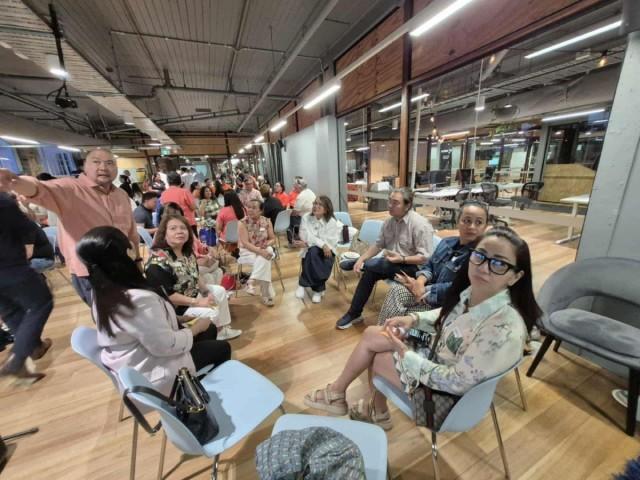 World Wellness Group's programme manager Rodel Josue (standing) discusses culture and mental health with Filipino community leaders in Brisbane, Australia on November 13, 2025. ARNULFO BAET