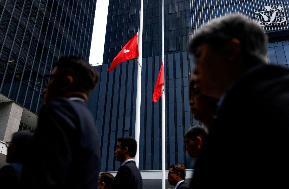 Hong Kong and China flags at half-mast
