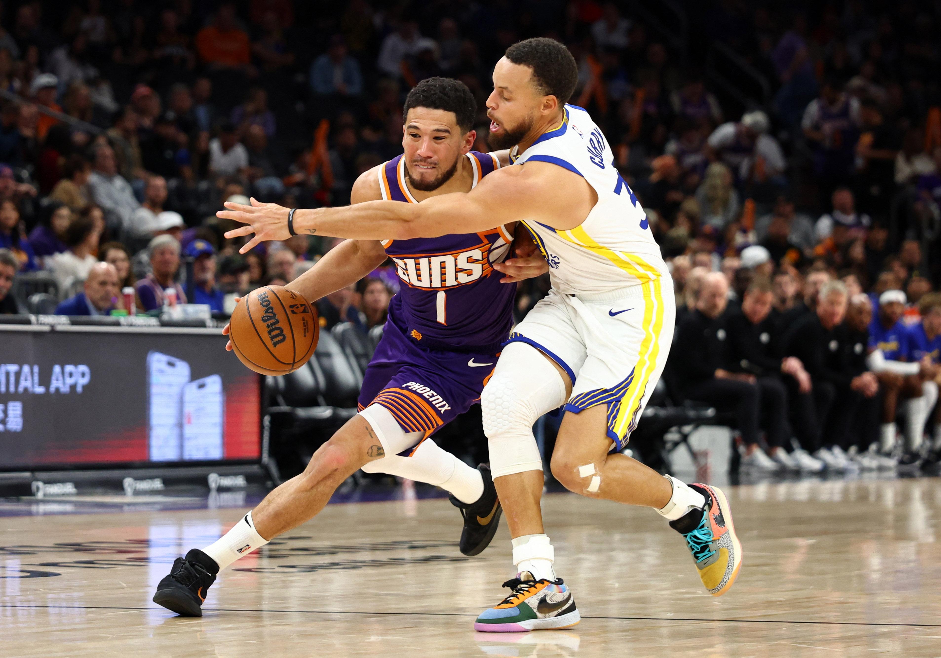 NBA: Devin Booker of the Phoenix Suns vs Steph Curry of the Golden State Warriors