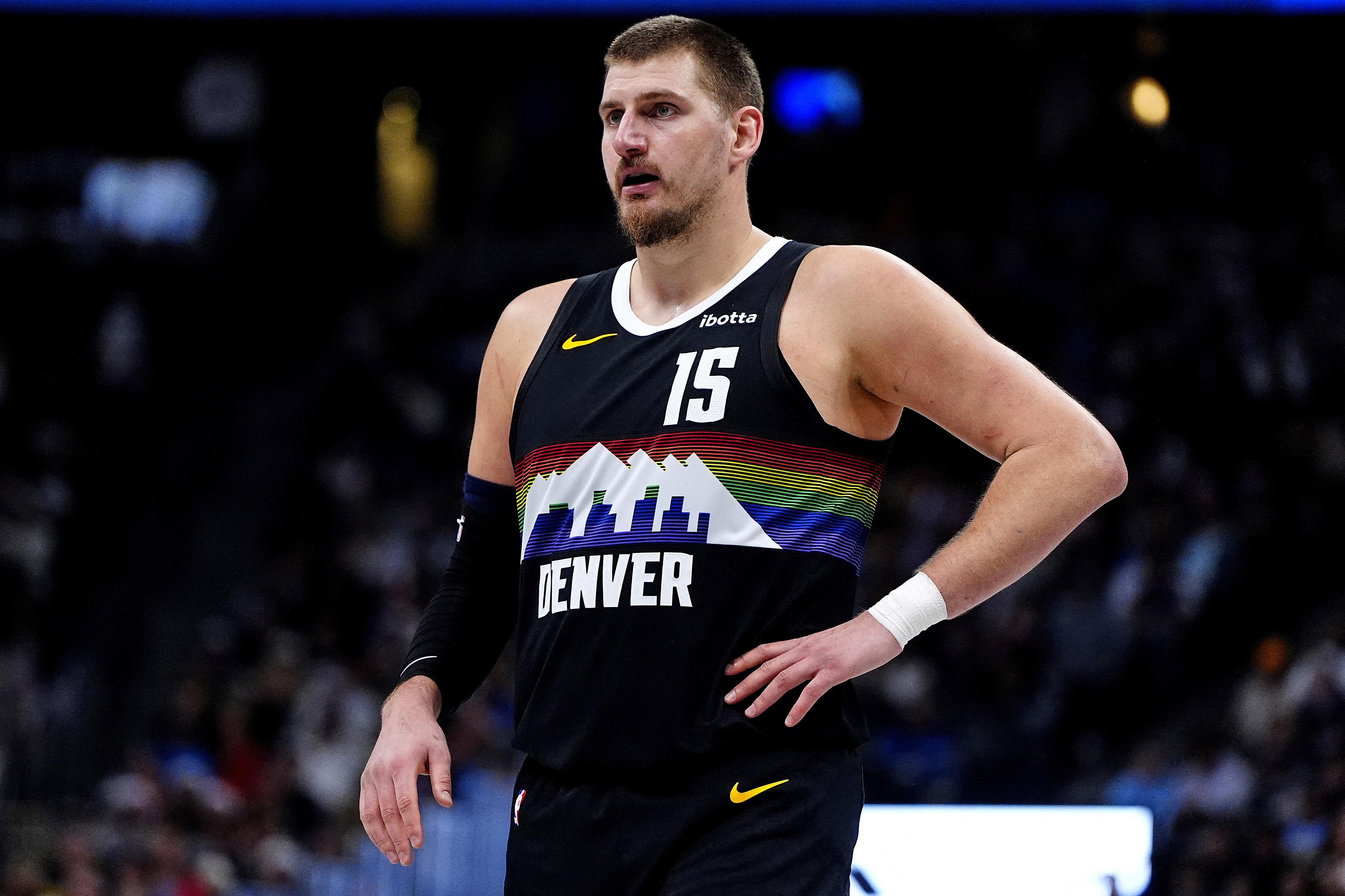 NBA: Nikola Jokic exits with knee injury as Heat handle Nuggets