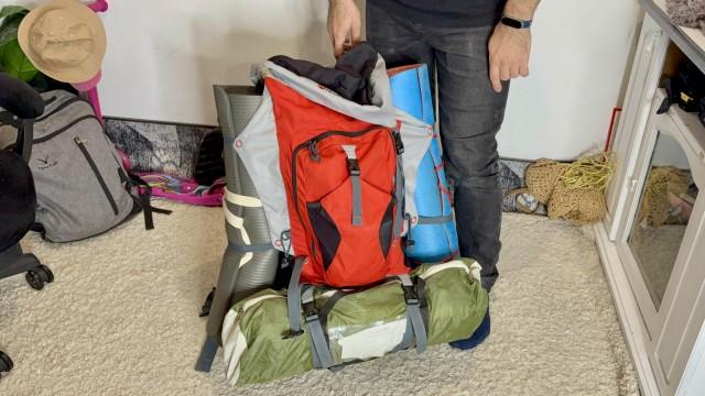 The Ramos-Taibov family has a âgo bagâ prepared in case of extended air raids on Kyiv, in which residents must stay overnight in underground shelters or bunkers. Their bag includes three sleeping mats, clothing, a first-aid kit, water, ready-to-eat food, and other essentials that will last at least a night. Andy Peñafuerte III