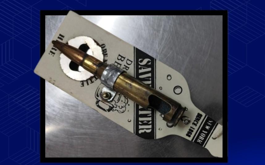 OTS confiscates bottle cap opener-shaped bullet shell from passenger at NAIA