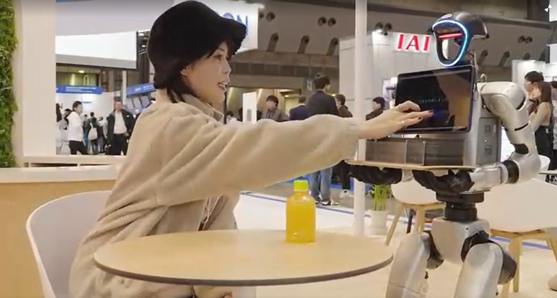 Robots dance, clean, and rescue toy cats at expo in Japan