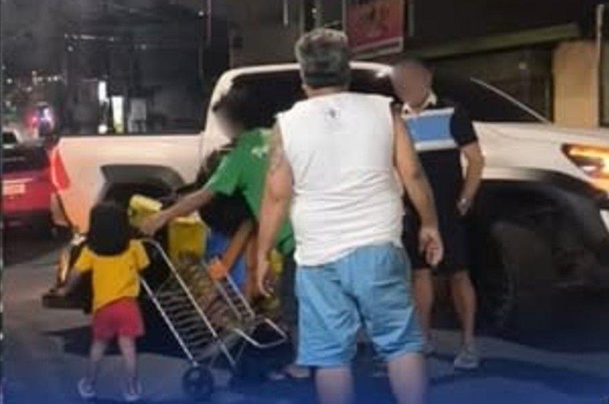 Motorist hurting a man pushing a cart