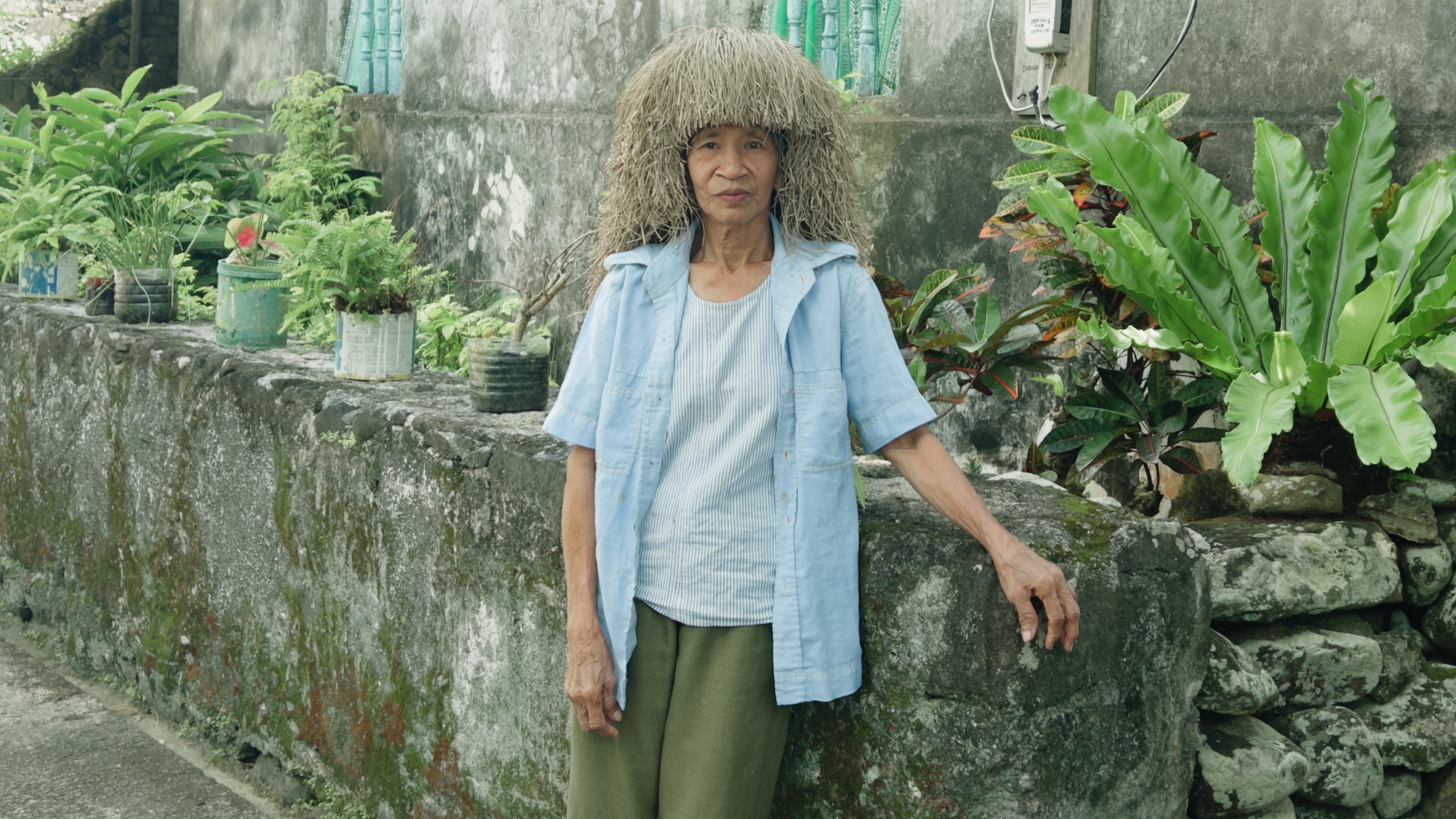 Priscilla Cabugao wears a vakul, the traditional headwear that has served generations of Ivatans in the fields of Batanes. 