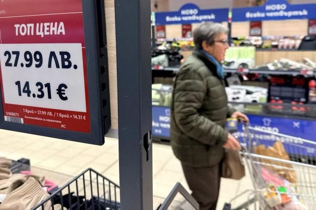 A woman shops inside a Lidl store where prices are displayed in both the Bulgarian lev and euro currencies, ahead of Bulgaria's adoption of the euro, in Sofia, Bulgaria, December 18, 2025. REUTERS/ Fedja Grulovic