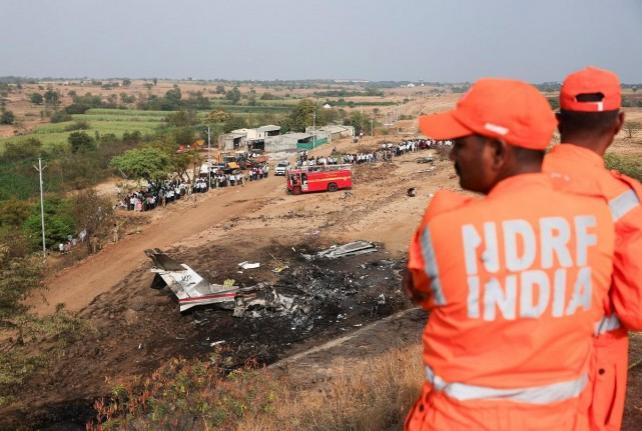 National Disaster Responce Force (NDRF) personnel look at the wreckage of the VSR Ventures-operated Learjet 45 aircraft in which Maharashtra Deputy Chief Minister Ajit Pawar and four others were killed after it crashed in Baramati, India, January 28, 2026. REUTERS/ Francis Mascarenhas